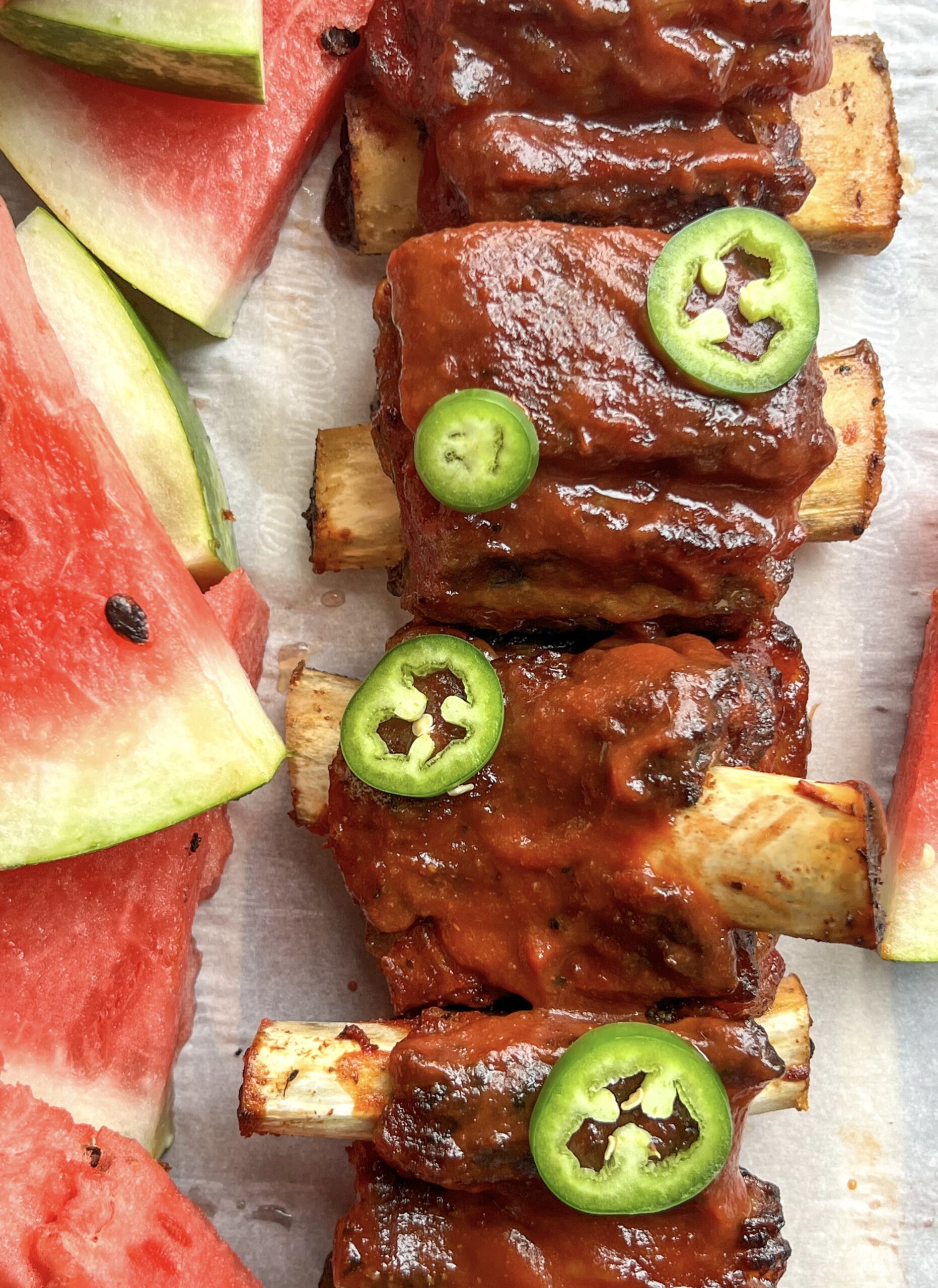watermelon bbq ribs topped with sliced jalapenos