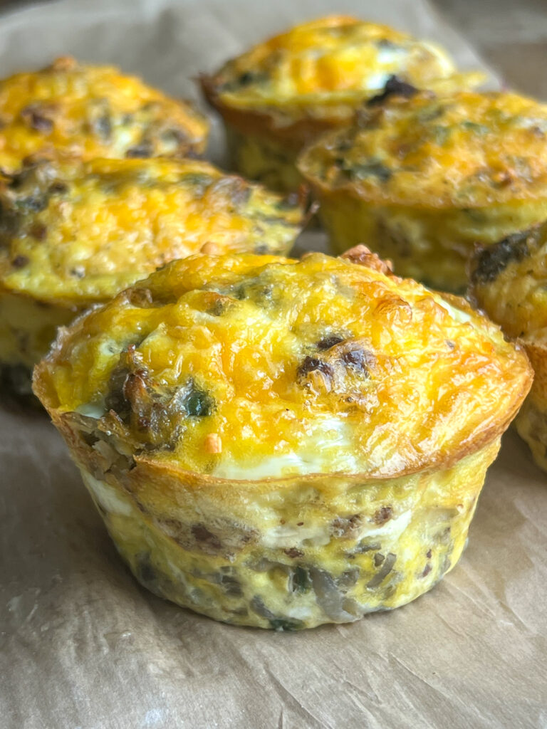 chorizo hash-brown egg bites on parchment paper