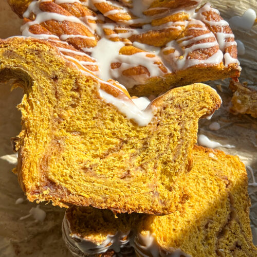 slices of pumpkin brioche cinnamon roll braided bread stacked