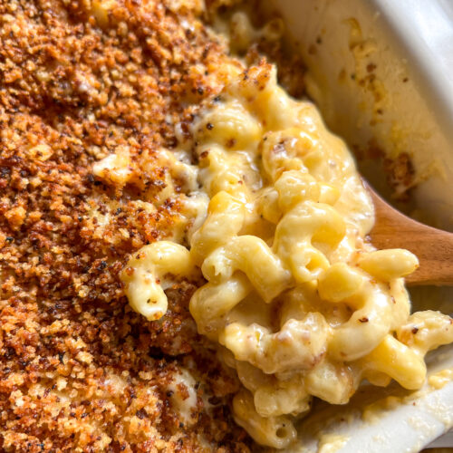 spoonful of macaroni and cheese in a casserole dish