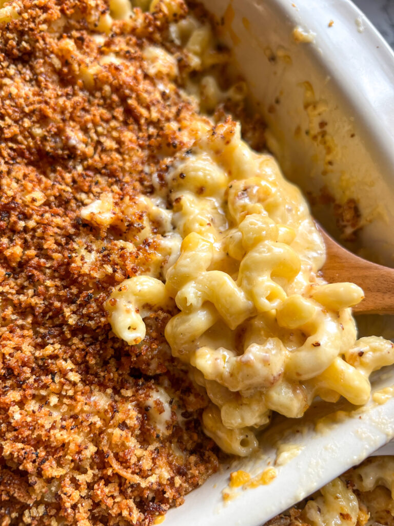 spoonful of macaroni and cheese in a casserole dish