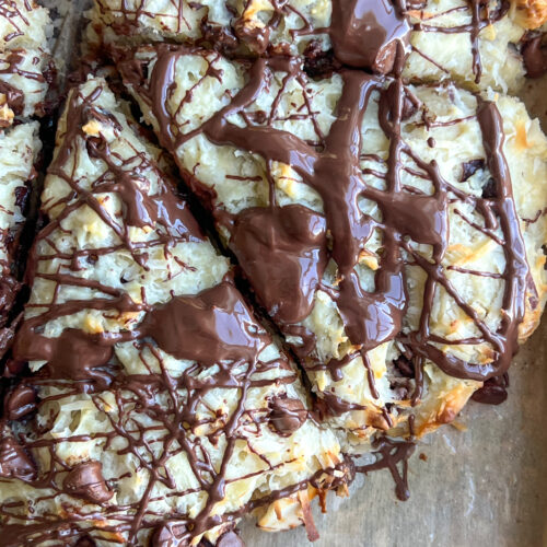Coconut chocolate almond scones on parchment paper