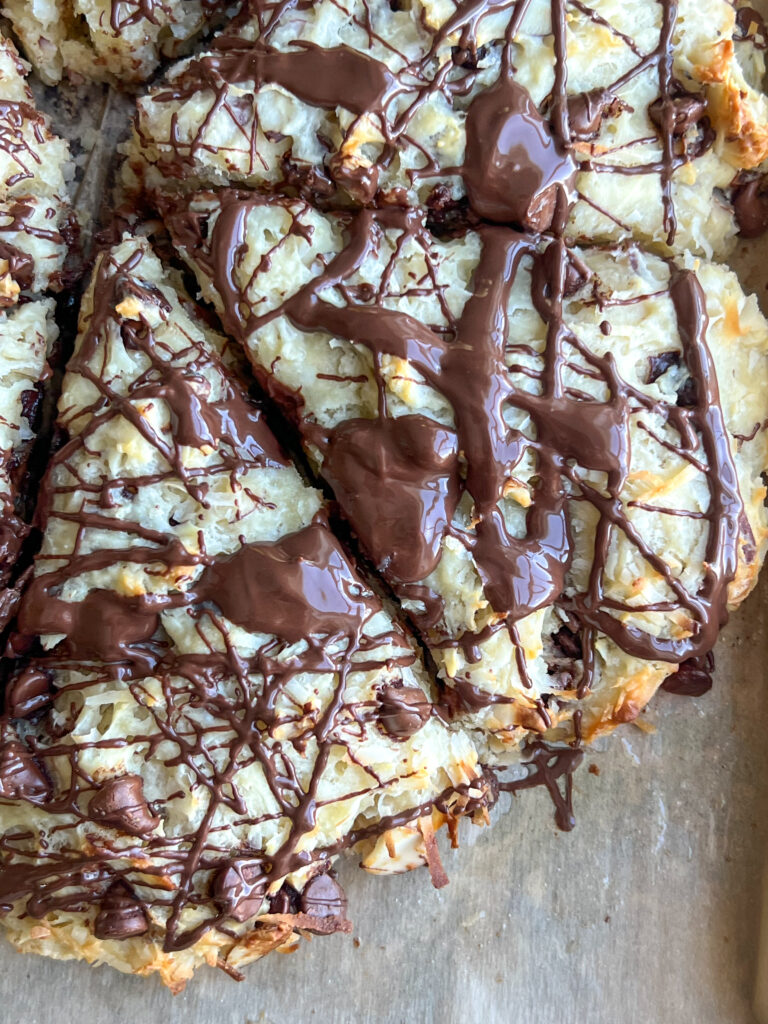 Coconut chocolate almond scones on parchment paper