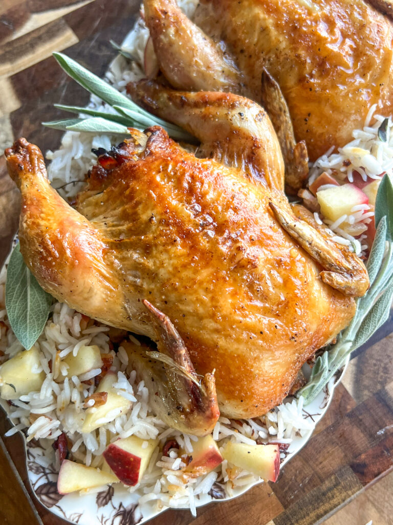 Cornish hens served over Apple Cranberry Rice stuffing